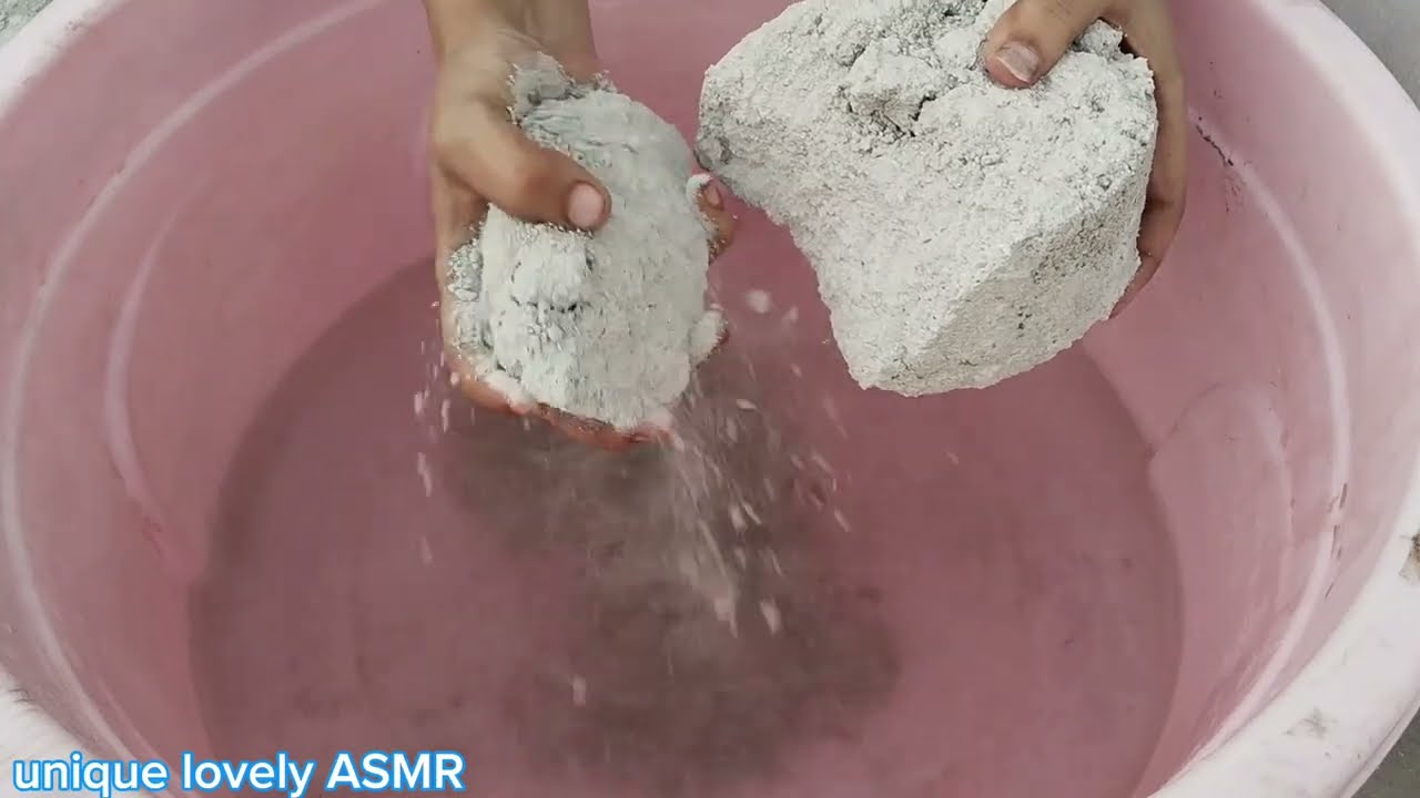 White grainy texture with white sand cement water crumbling yummy paste mixing satisfying ASMR.