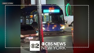 MTA bus strikes 2 pedestrians after unhooking from tow truck