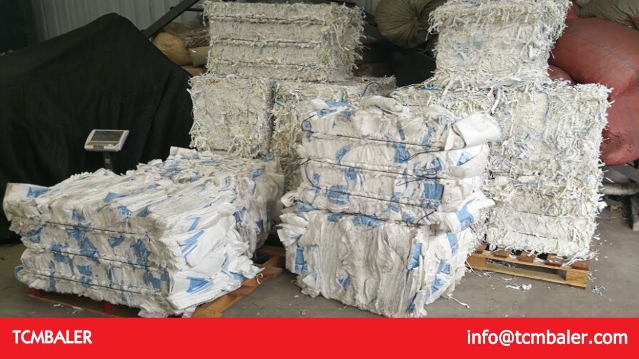 baling newspaper with a downstroke baler