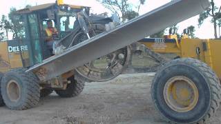 swinging the saddle out on a motor grader
