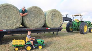 Moving hay bales around the farm | Tractors working for kids