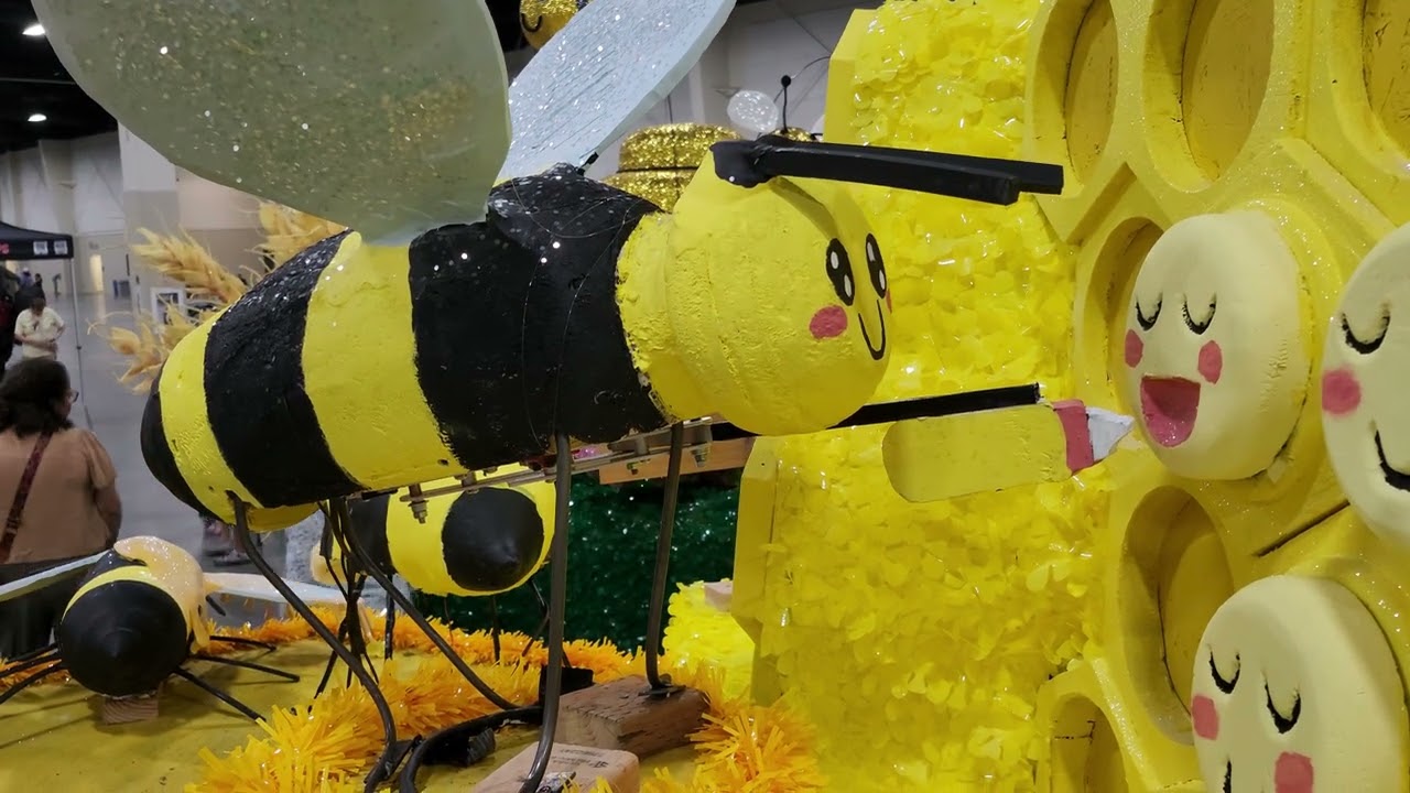 Nurse bee feeding a baby bee larva