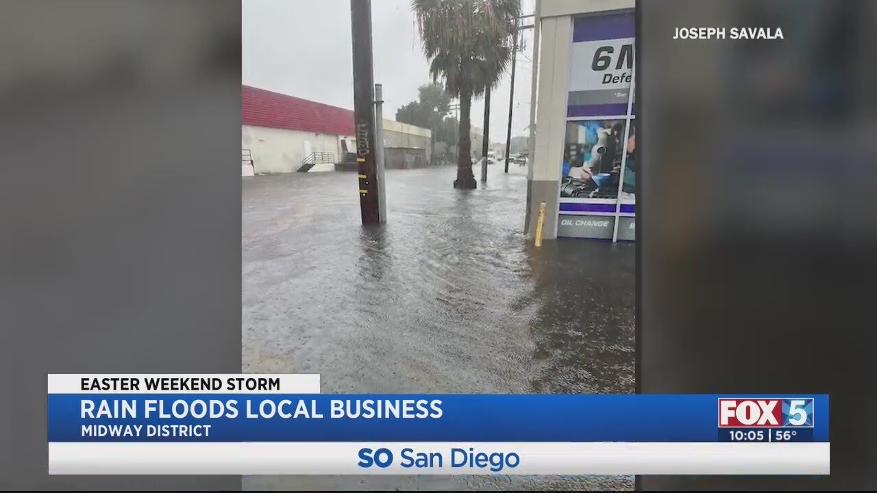 After tire shop floods, employee carries elderly customer to safety