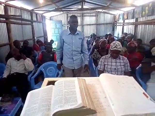 Brother Joseph Teaching the Ezra 4:13-21 & Rev 5:1-5 WFF/GMFC Kibera Slum Church