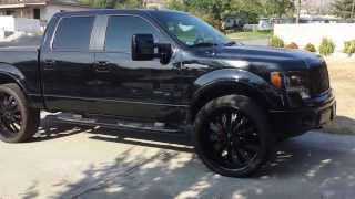 Ford F150 on 28s with a Whipple Super Charger 3 12 inch subs custom box and suede headliner