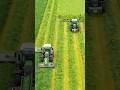 FENDT tractor working in a field tedding grass