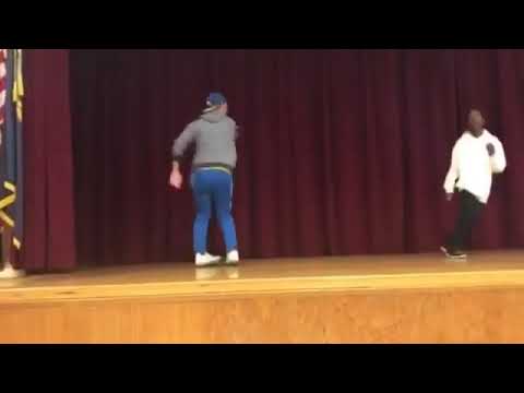 Teacher owns student in dance off.