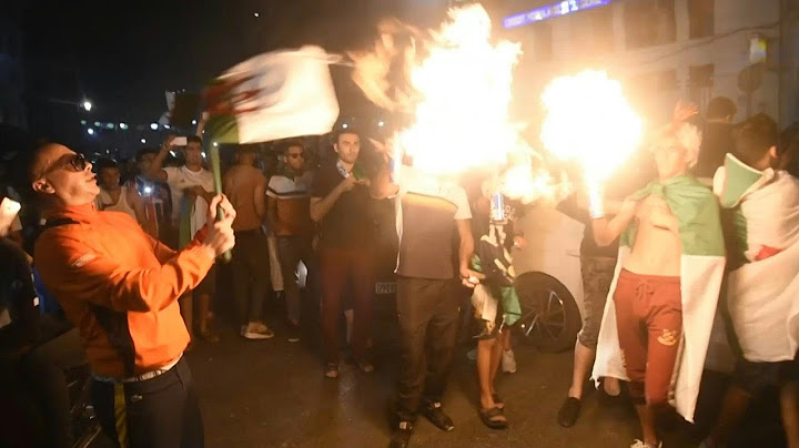 Algerians celebrate team's win at the Algiers' Post Office | AFP