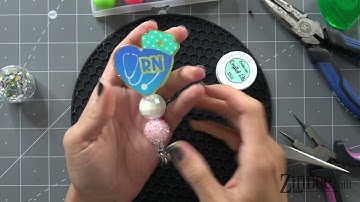 Badge Reels.  How to add beads and decorate the snap of a badge reel.  Acrylic badge reel tutorial.