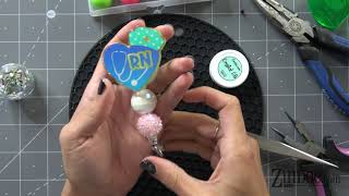 Badge Reels.  How to add beads and decorate the snap of a badge reel.  Acrylic badge reel tutorial.