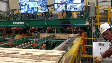 High speed, Low-Profile Stacker with “catching lug” and “pick-up on the fly” features