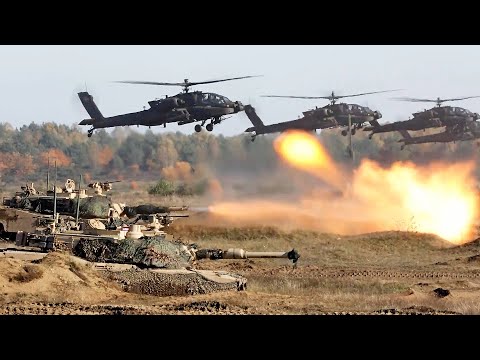 Polonya'daki tatbikatlarda AH-64 Apache ve M1A2 Abrams tanklarına saldırı helikopterleri.