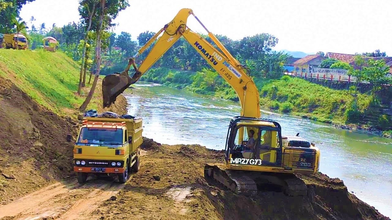 River Sedimentation Clearing By Komatsu PC200 Excavator And Dump Trucks ...