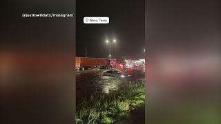 Watch: Car floats away in floodwaters along I-35 near Waco
