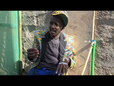 Njugush awekewa mchele akiwa Kwa huduma
