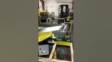 Pallet Decoiler in action feeding into a Rollformer