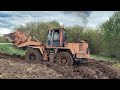 Tractor stuck in deep mud driving offroad on heavy equipment