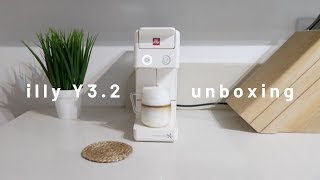 coffee machine unboxing and a warm cup of cappuccino