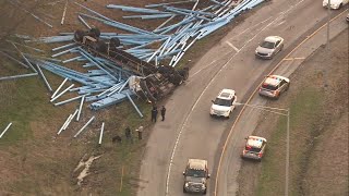 Semi hauling pipes overturns in Lake County shows