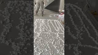 Applying Adhesive Foam Evenly for Professional Floor or Panel Installation