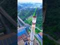 High Altitude Maintenance On Hundred Meter Chimney, Workers Operate In Crane Basket