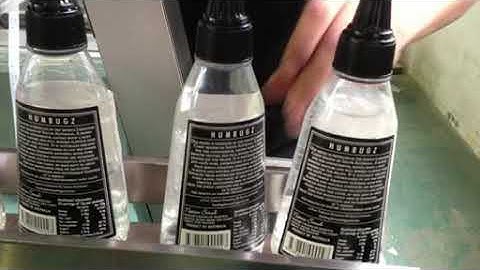 DLM A cone bottle two sides labeling machine