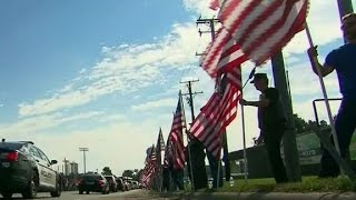 Thousands pay their respects for slain officer