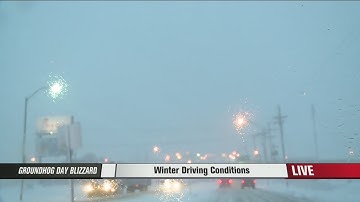 Snow falling fast, plows try to keep up