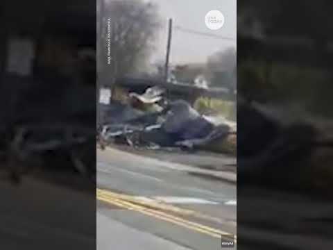 Tractor-trailer stuck on tracks slammed by oncoming train | USA TODAY #Shorts
