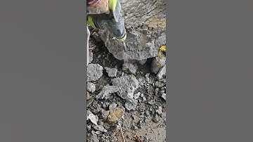 The process of crushing concrete blocks with percussion drilling