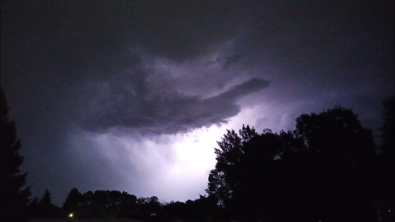 Bright lightning flashes and deep thunder rumbles (night time