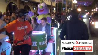 Peter Gadiot and Sophie Lowe on a bike taxi on streets of San Diego Comic Con