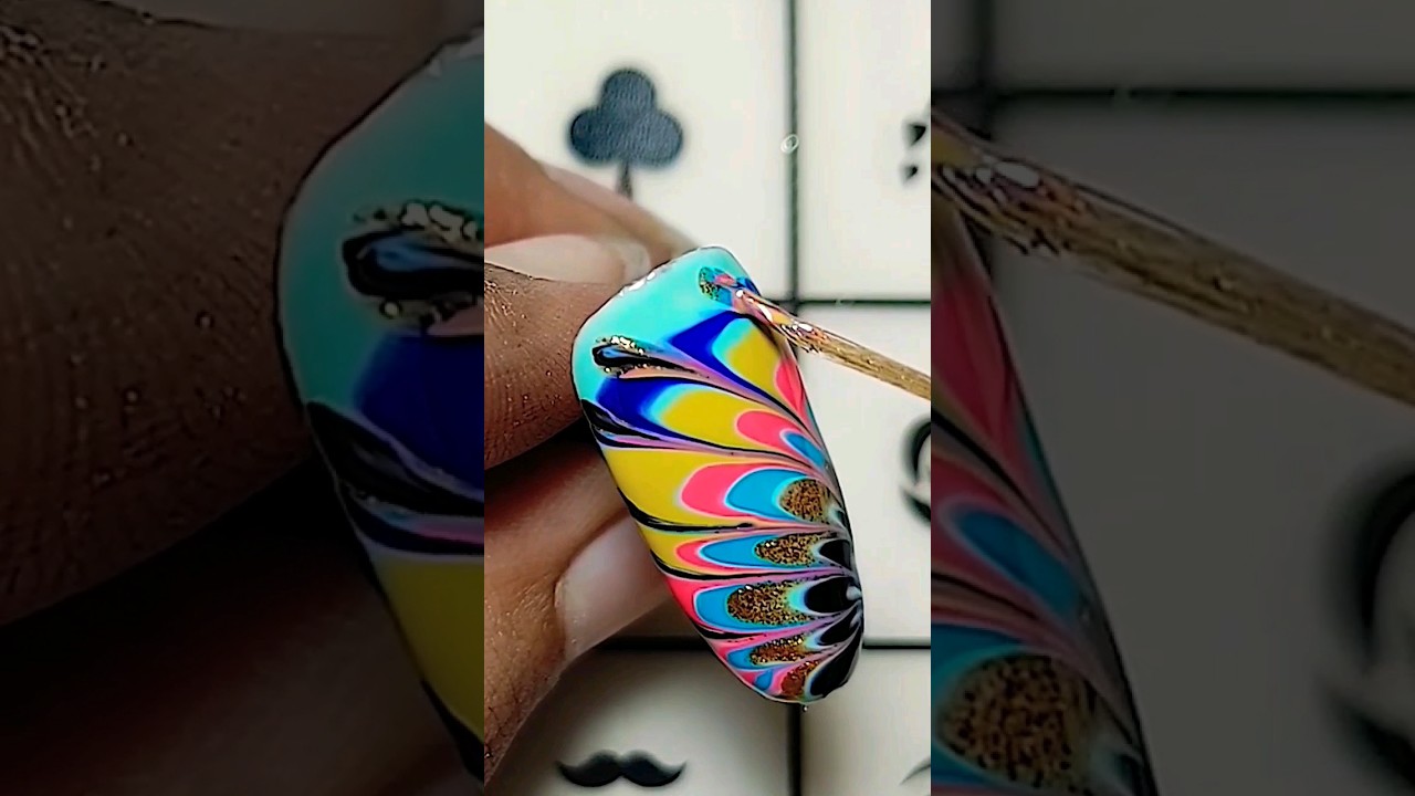 Peacock inspired nail art design 