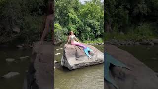 Pink and blue mermaid sitting on a rock in a river #mermaid #shorts #mermaidtail #realmermaid