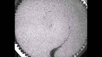 Surface flow in sheared granular media