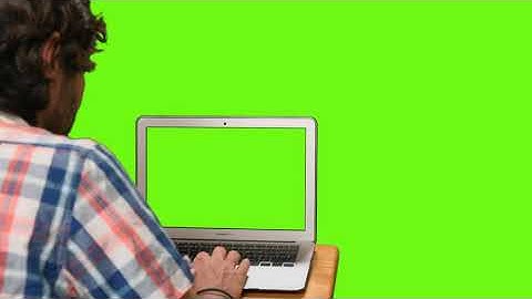 Free Footage - Boy on his computer with green screen on a chroma background