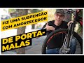 Suspensão caseira feita com amortecedor de porta-malas de carro. Pedaleria