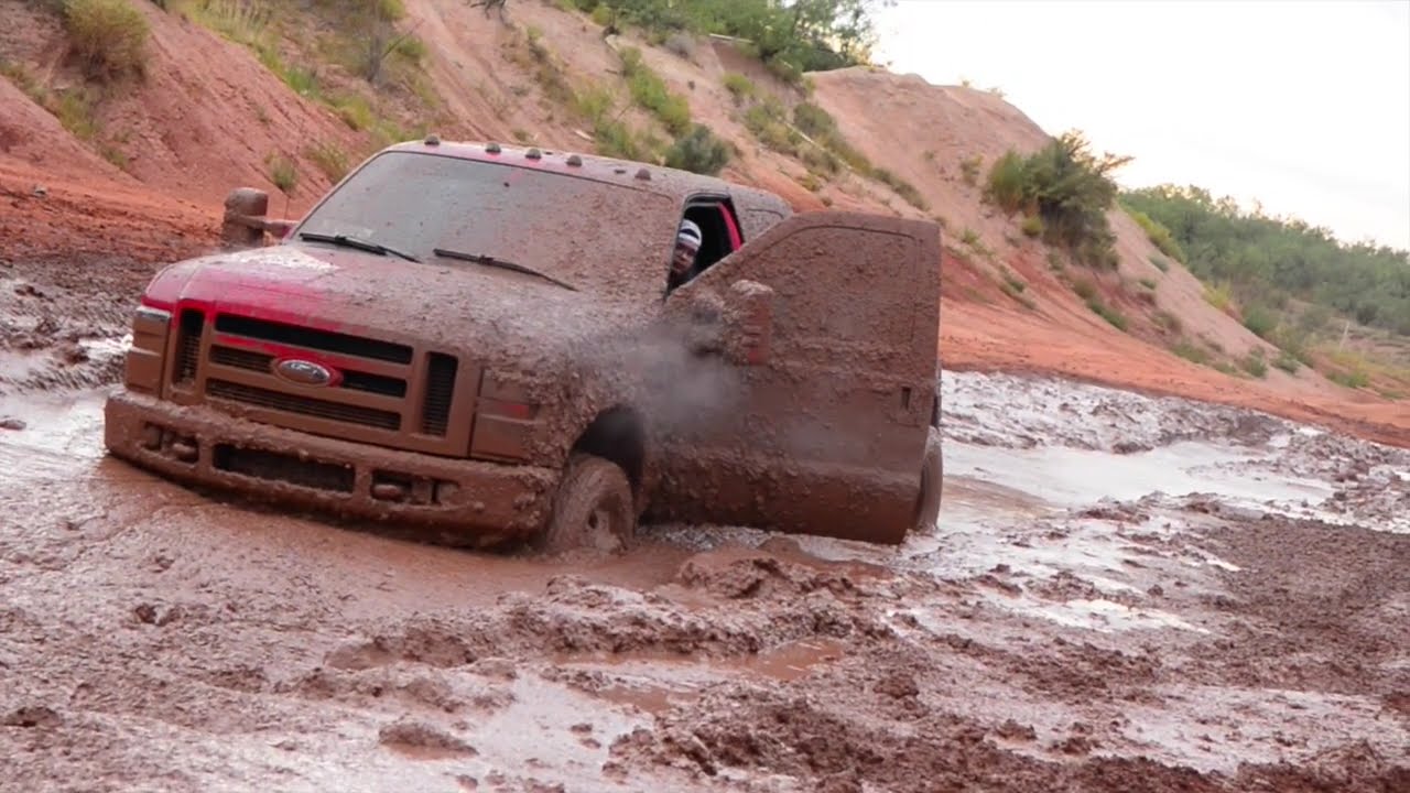 Big trucks go mudding in west Texas! - YouTube
