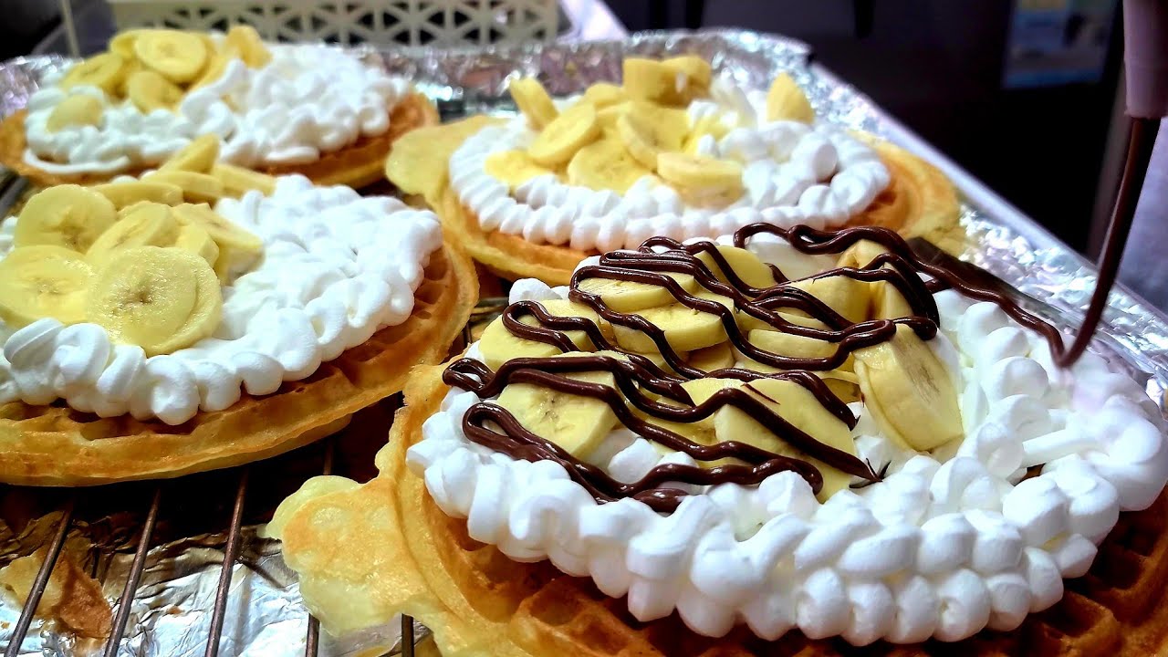 A popular korean waffle with whipped cream (Nutella, Banana) Korean