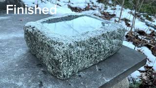 Birdbath made out of a granite block