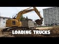 Komatsu PC228USLC Loading out Dump Trucks