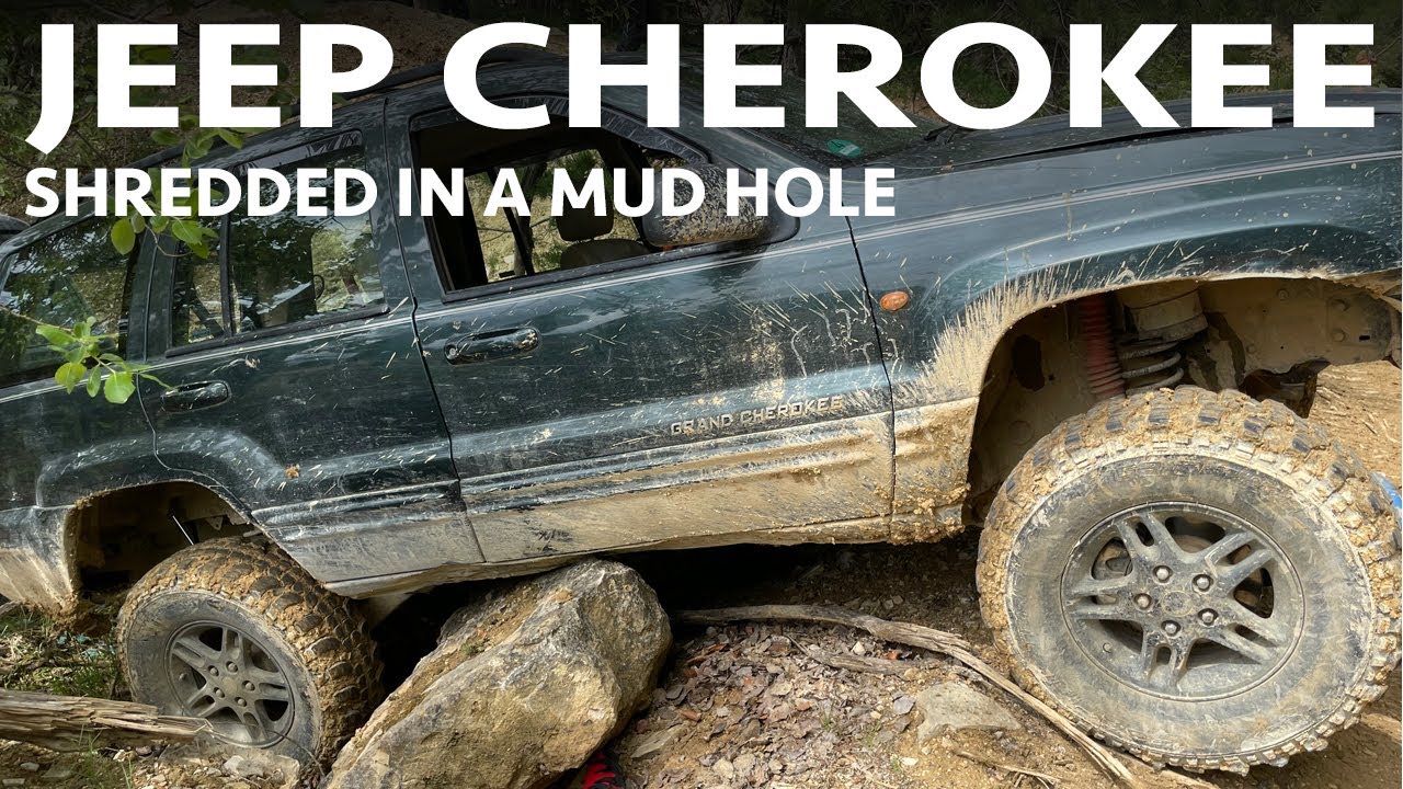 Jeep Cherokee shredded in a mud hole
