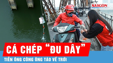 Người dân Thủ đô thả cá chép “đu dây”, tiễn ông Công ông Táo về trời | Tin tức