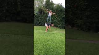 Guy and girl do TikTok WOAH challenge then girl falls off his shoulders and faceplants into grass