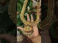Jiledi haram with rubies,pearls &amp; Large pendant with Lakshmi and peacock motifs &amp; green emerald bead