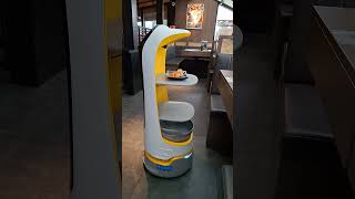 Robot waiter waits patiently for people to return to table. #robotwaiter #robotdelivery