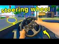 Using a steering wheel in drive world