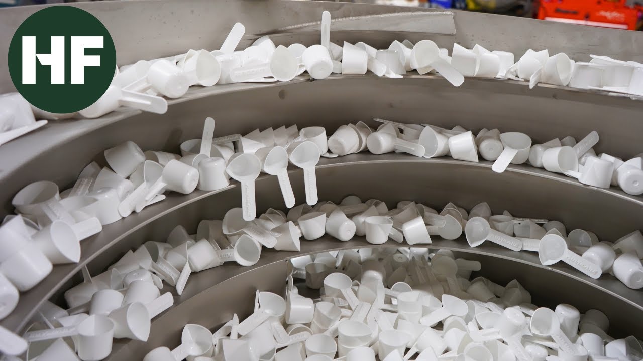 Vibratory Feeder: 70 PPM Custom Scoop Orientation System with Holdback/Release Escapement Feature