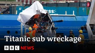 Titanic tourist sub wreckage brought ashore - BBC News