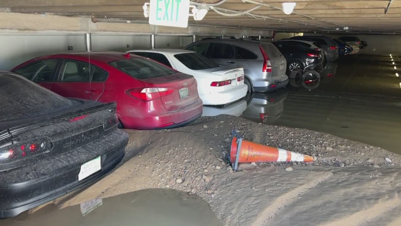Denver Water main break floods parking garage, cars - YouTube